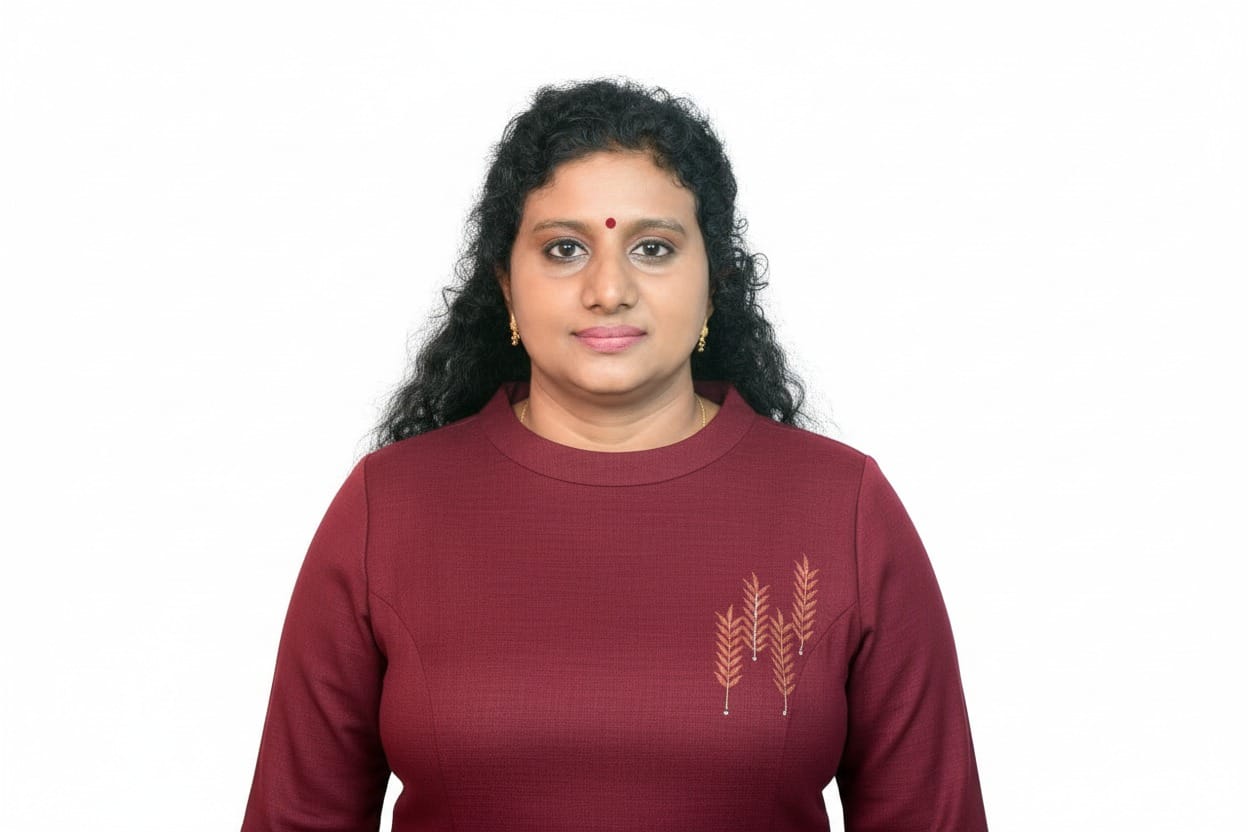 Portrait of Sindhu Arahvindhan wearing a burgundy top
